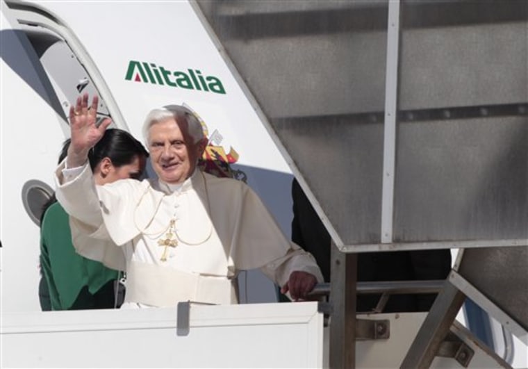 Pope Benedict XVI waves as he boards a plane for Cyprus at Rome's Fiumicino airport on Friday. Benedict XVI's visit likely to be colored by shock over the killing in Turkey of a bishop who had been scheduled to meet with the pontiff.